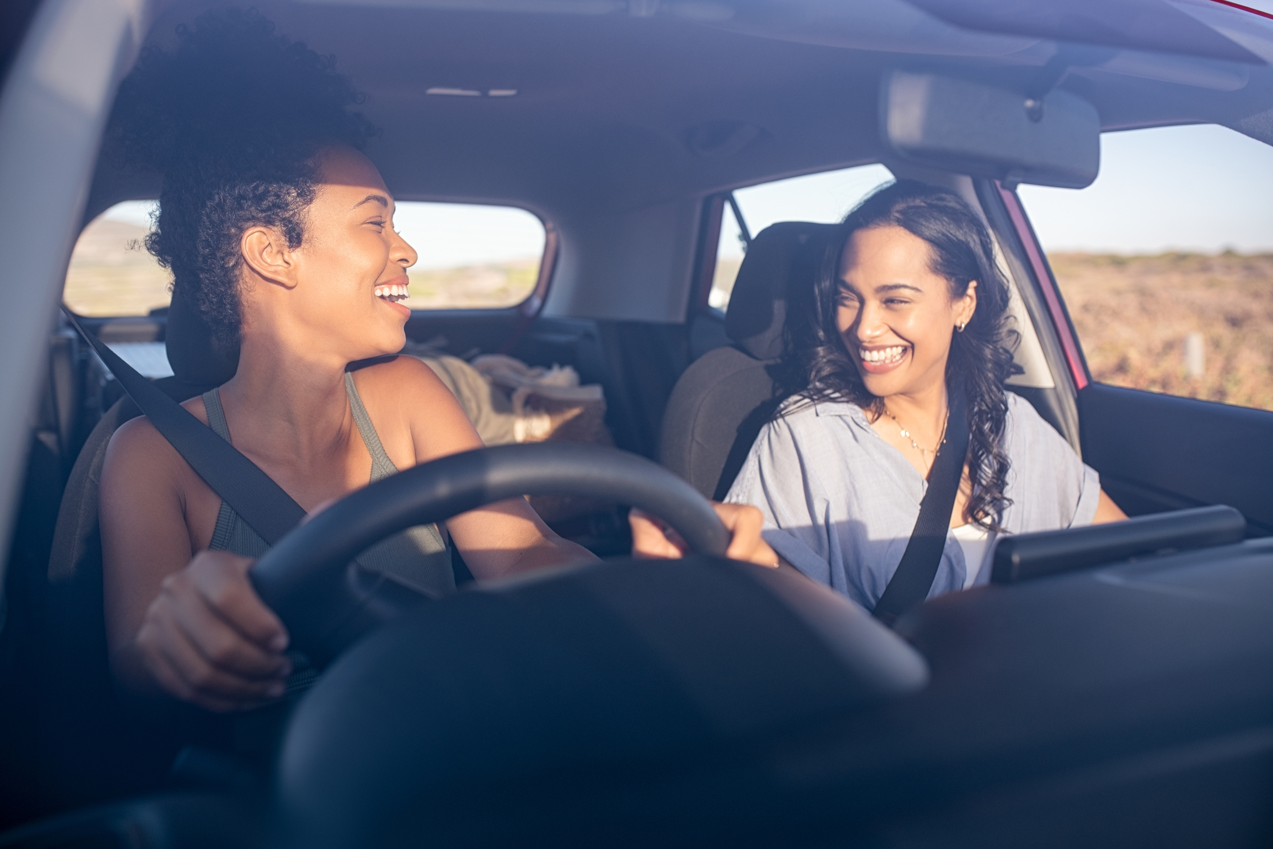 Happy Lesbian Couple in a Car